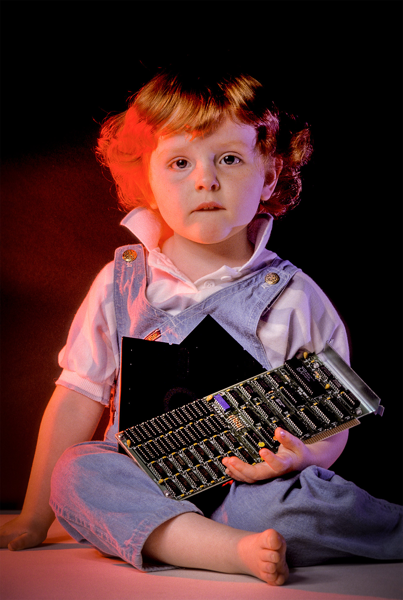 child with computer components