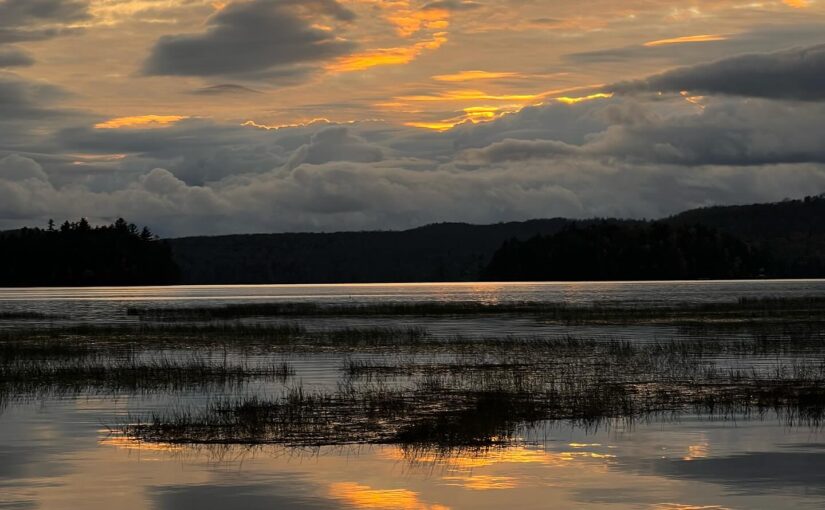 sunset over Tupper Lake, ominous clouds